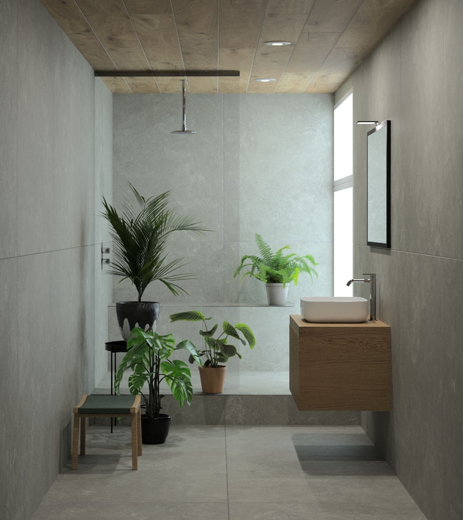 Salle de bain moderne au design biophilique avec plantes, accents en bois et carreaux effet béton, en accord avec les tendances actuelles des salles de bain.